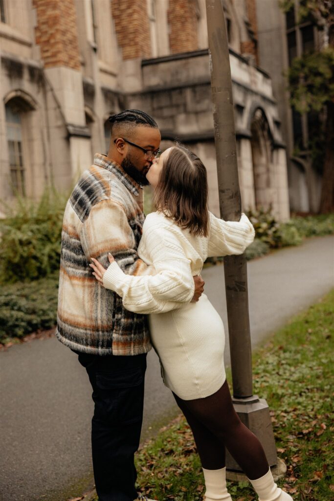 picture of the newly engaged couple kissing