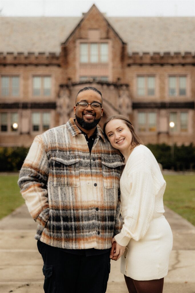 couple smiling at the camera during their photoshoot