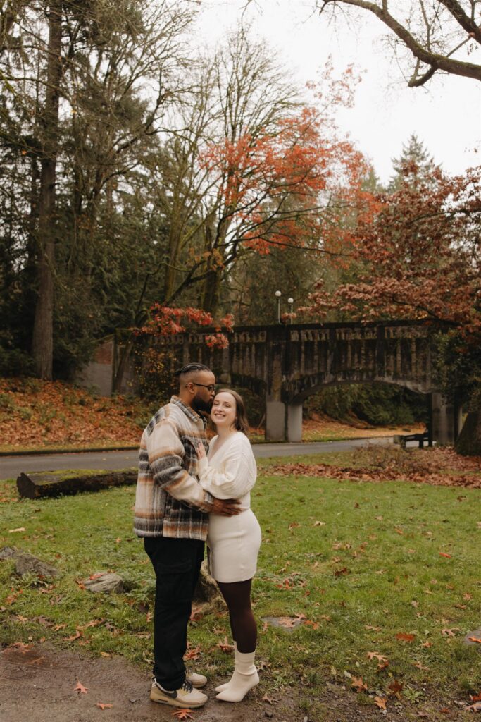 fiance kissing his fiance on the forehead