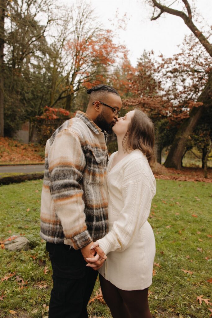 portrait of the newly engaged couple kissing