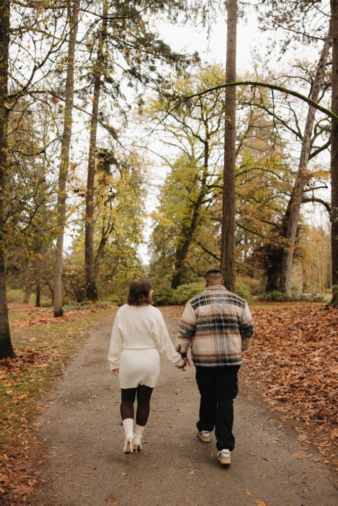 cute picture of the newly engaged couple holding hands