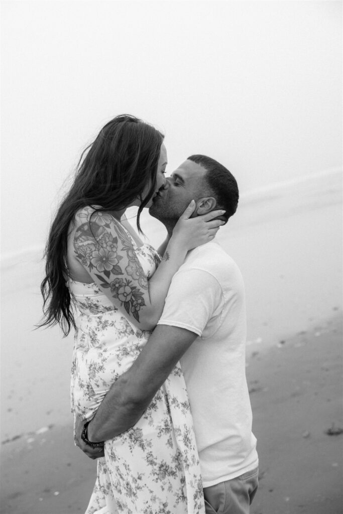 cute picture of the newly engaged couple kissing