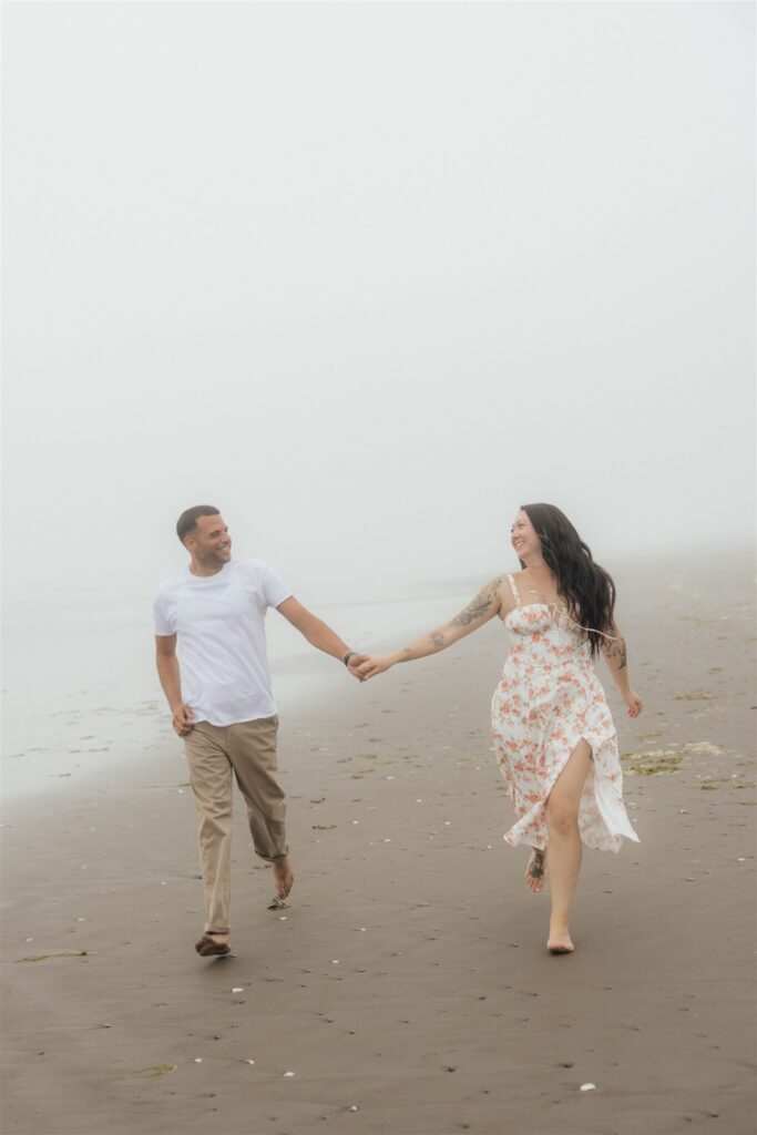playful couple portraits at the beach