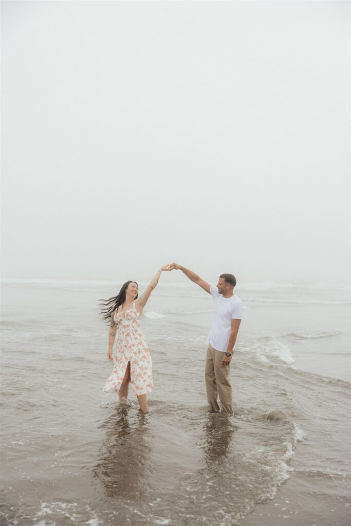 cute picture of the newly engaged couple dancing during their photoshoot