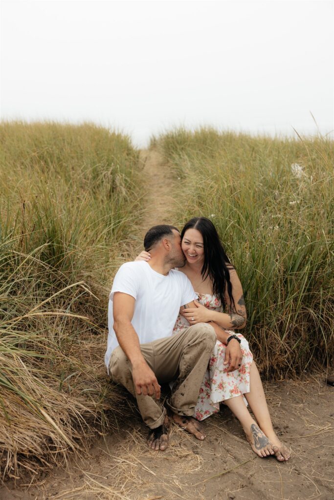 cute portrait of the newly engaged couple at the beach