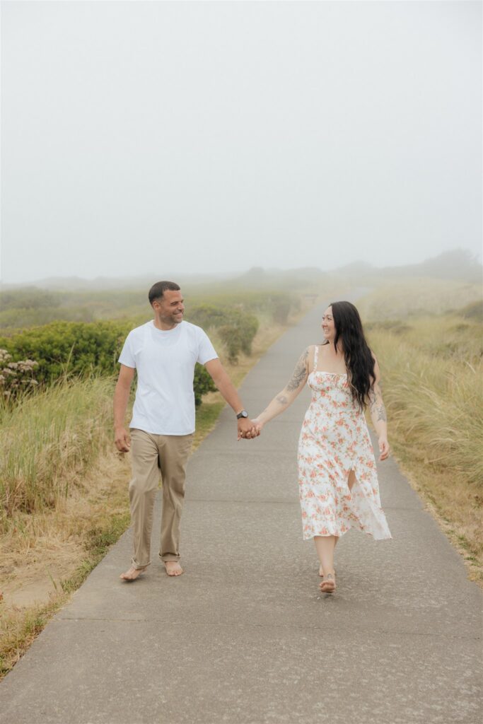cute picture of the newly engaged couple laughing with each other during their photoshoot
