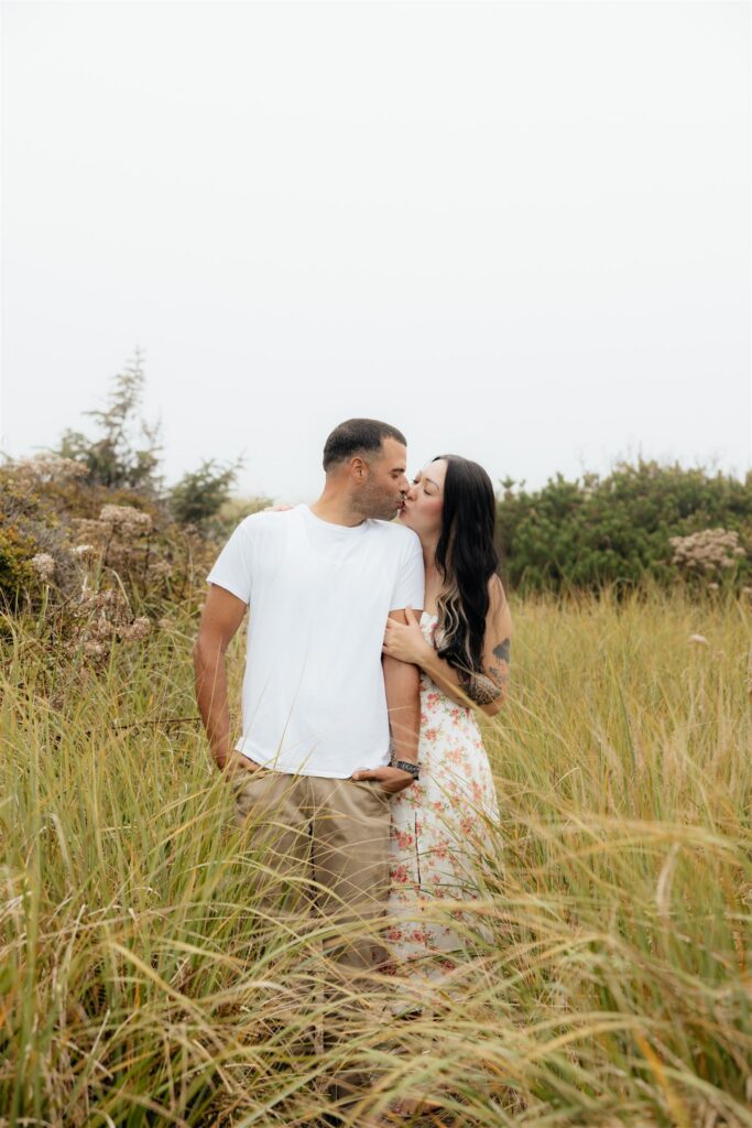 portrait of the newly engaged couple kissing