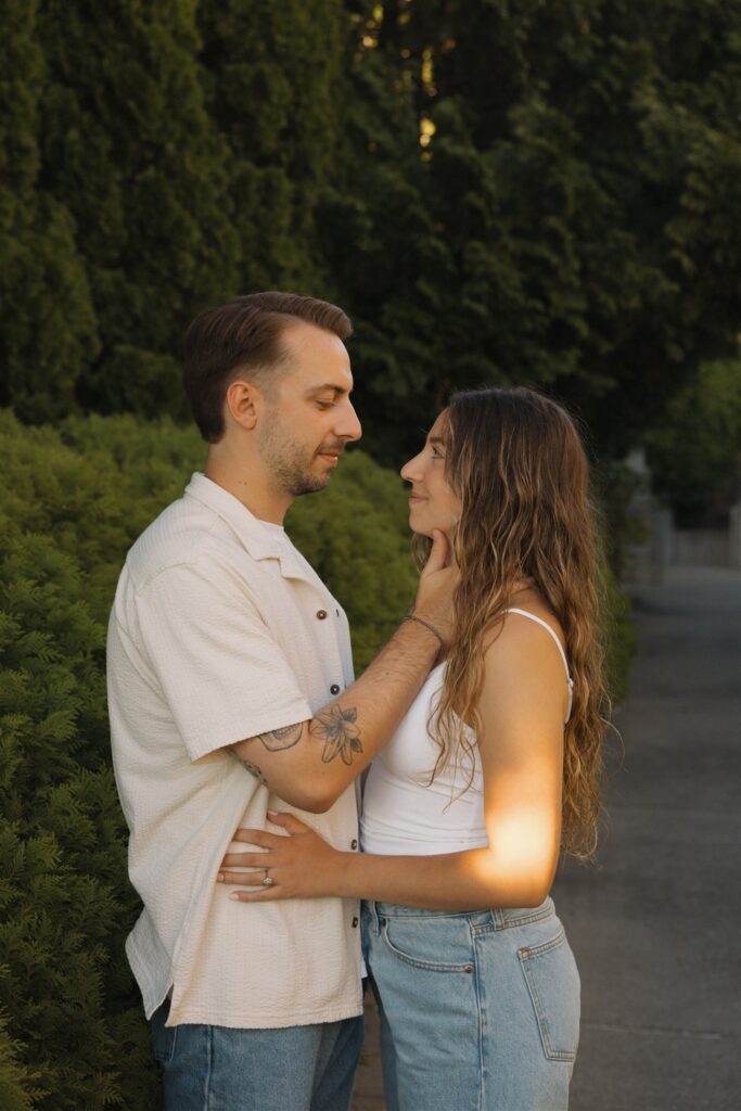cute picture of the newly engaged couple smiling at each other
