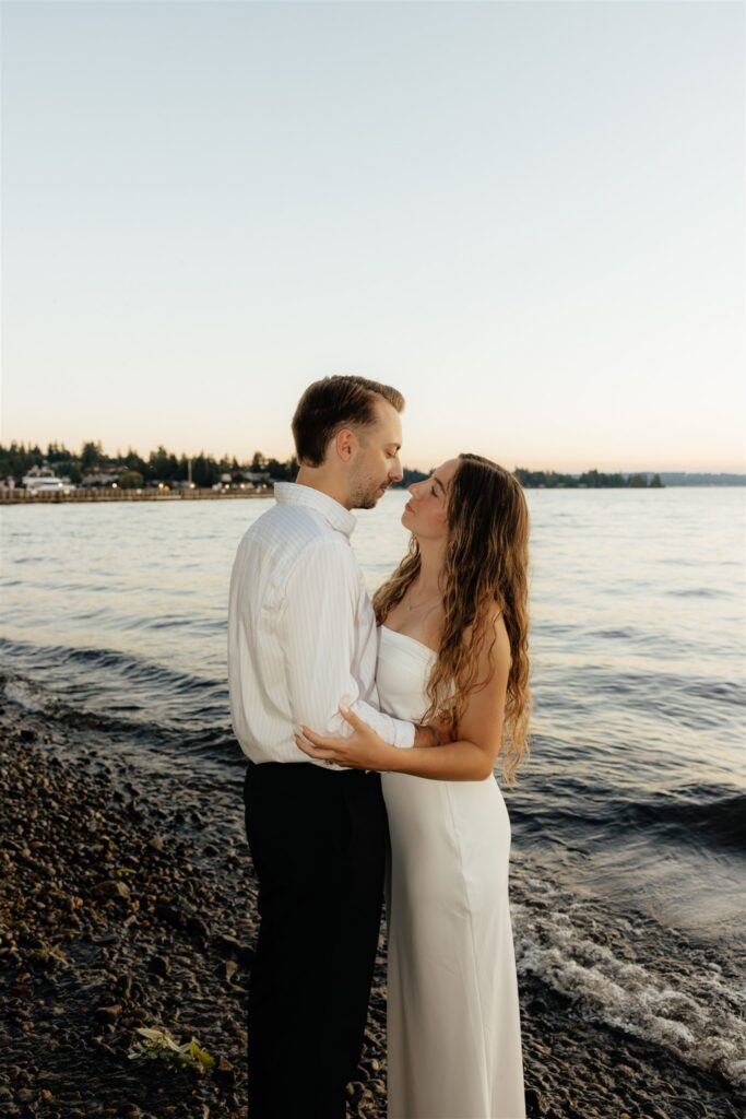 cute picture of the newly engaged couple smiling at each other
