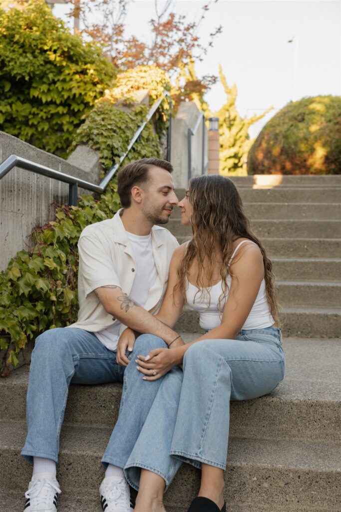 newly engaged couple laughing with each other during their photoshoot