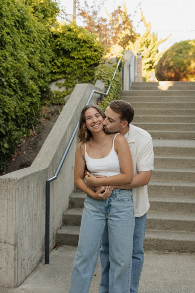 fiance kissing his fiance on the cheek