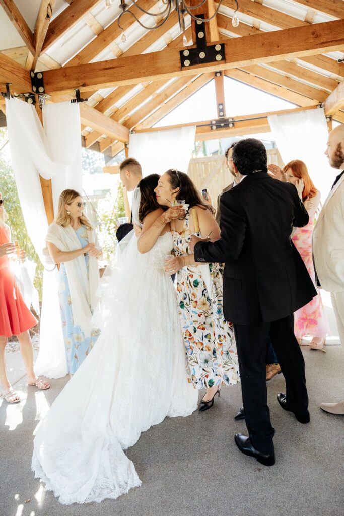cute picture of the bride hugging one of her guests