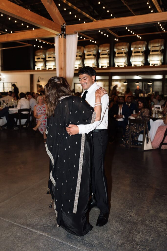 cute picture of the groom and his mom dancing