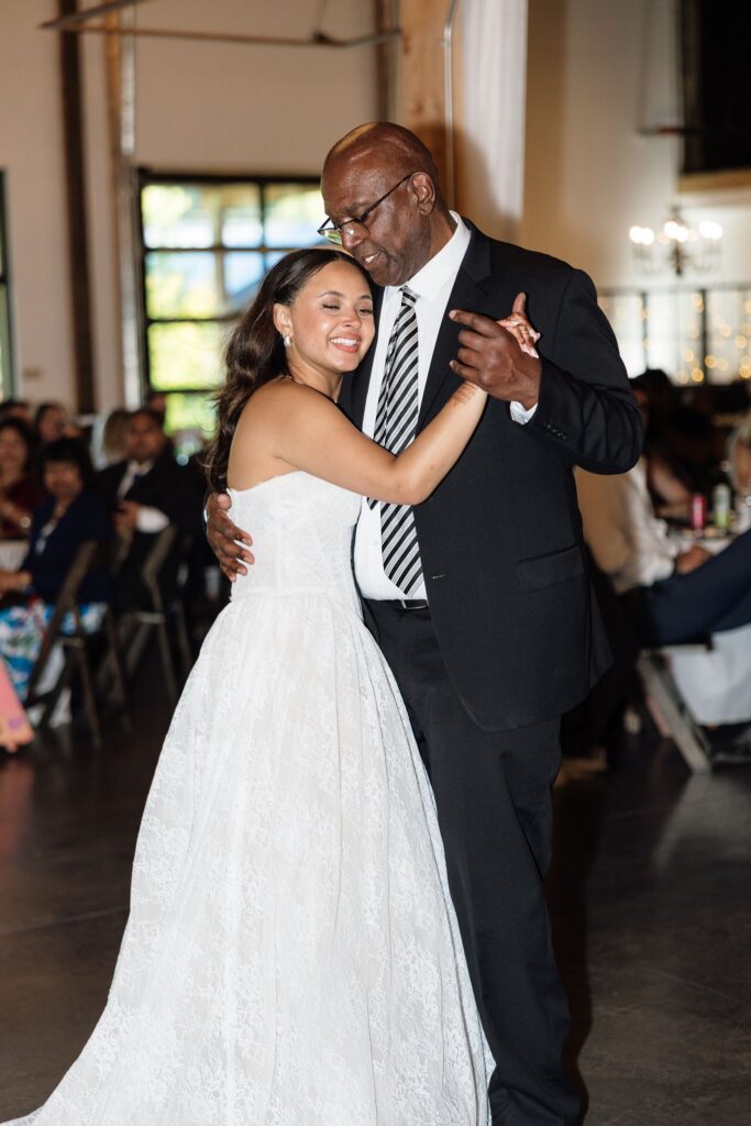 cute picture of the bride and her dad hugging