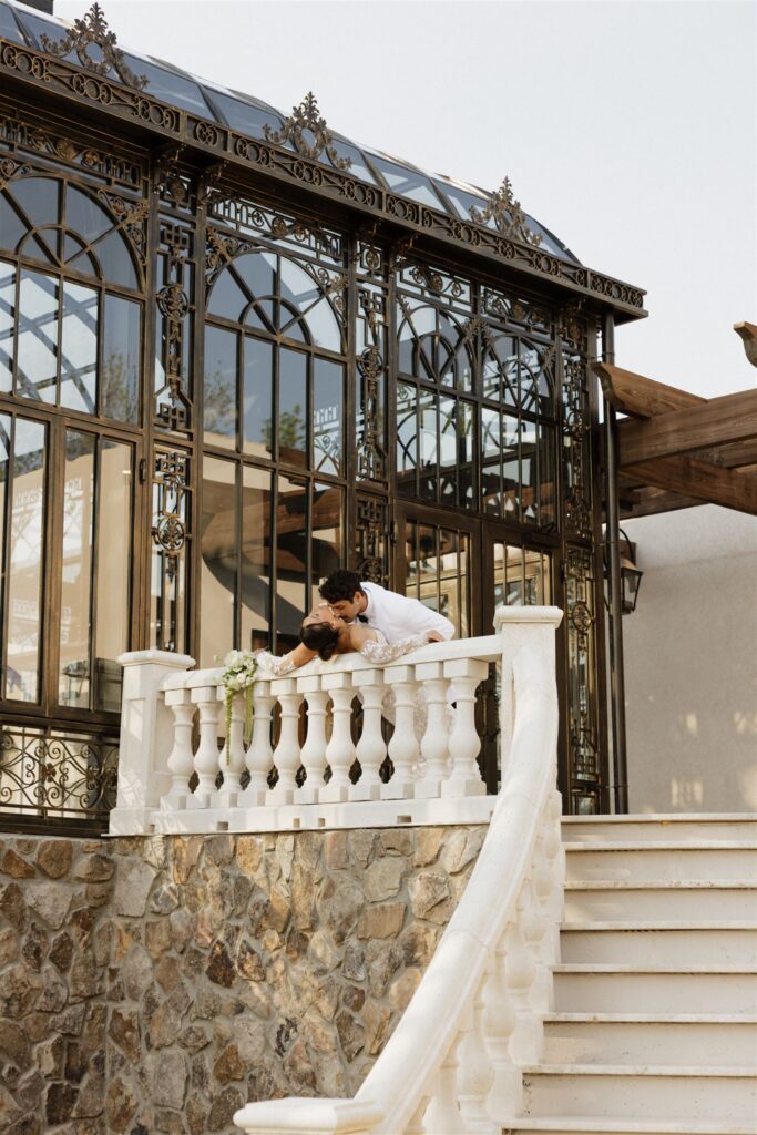 groom kissing the bride on the cheek