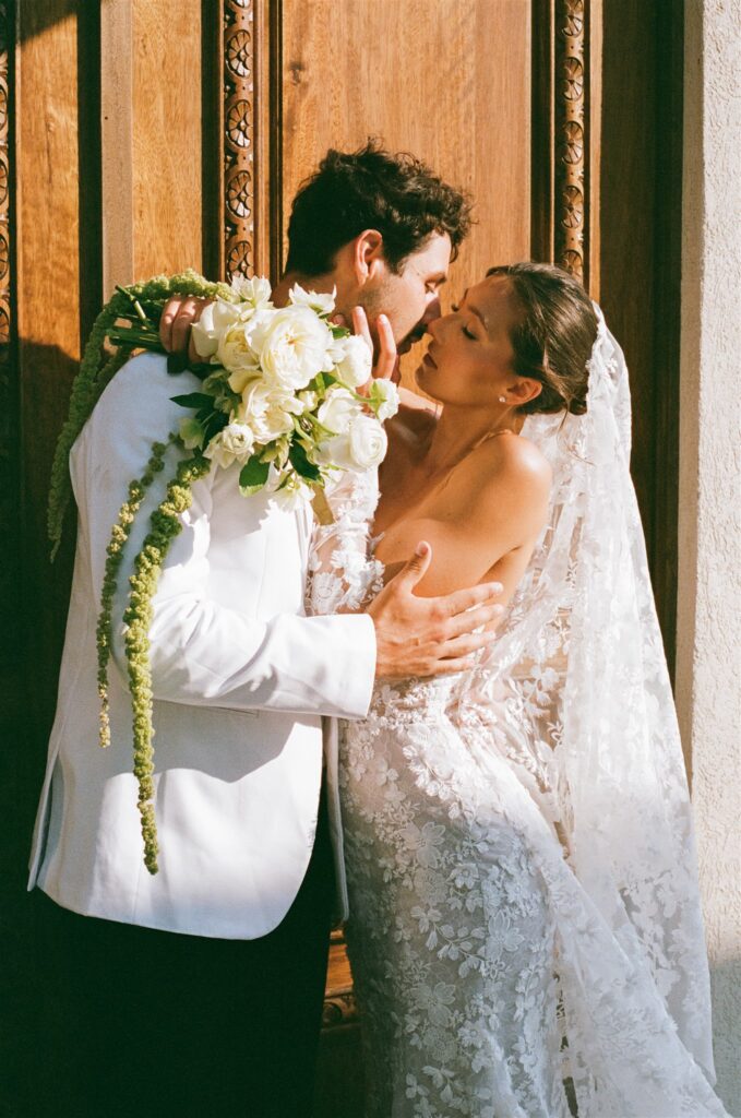portrait of the bride and groom kissing