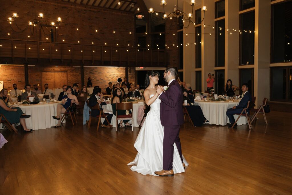 cute picture of the newlyweds kissing at their reception party