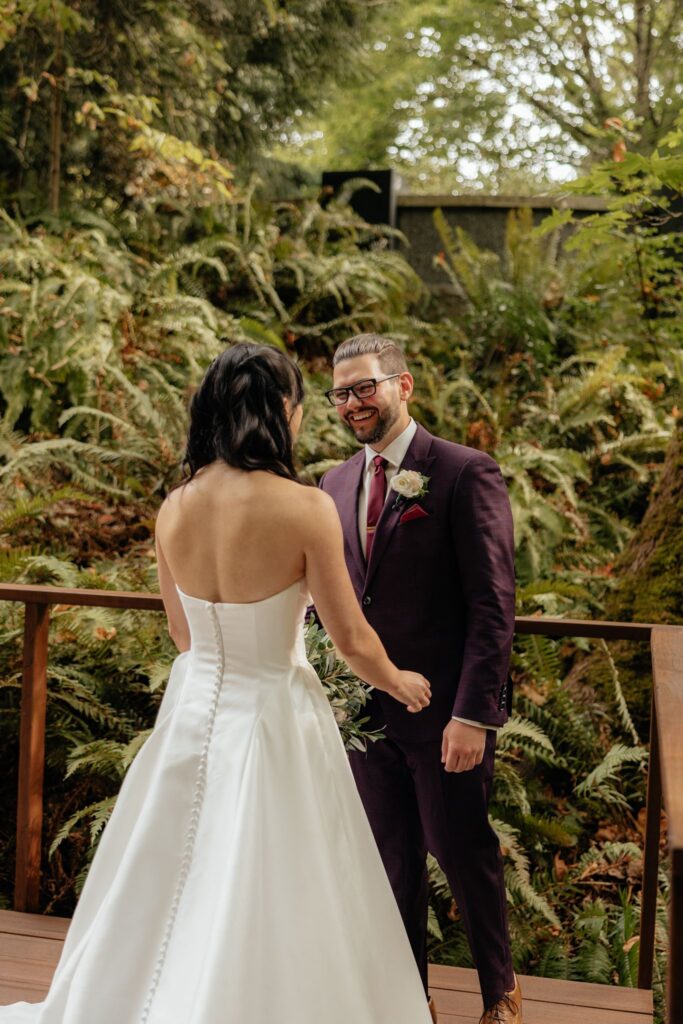 groom emotional seeing the bride in her wedding dress