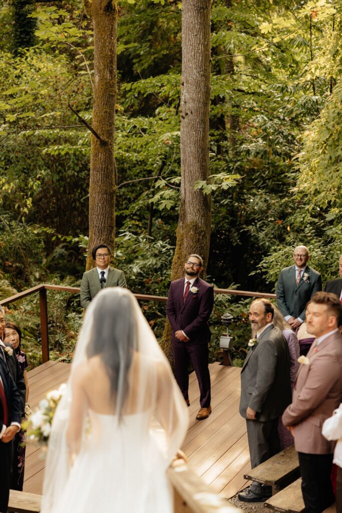 groom emotional watching the bride walk down the aisle