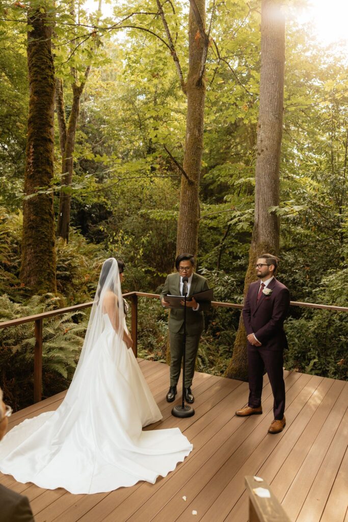 bride and groom holding hands during their ceremony