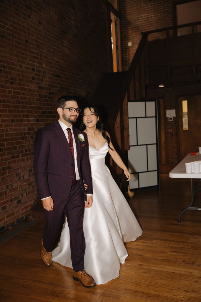 newlyweds arriving at their wedding reception