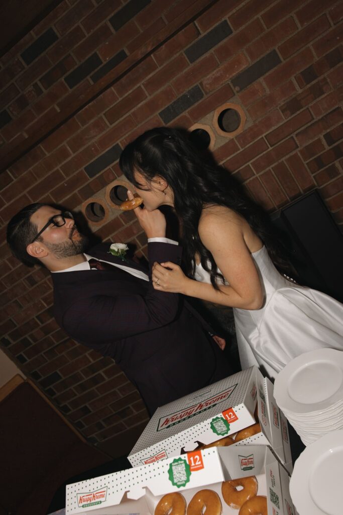 newlyweds trying their wedding dessert