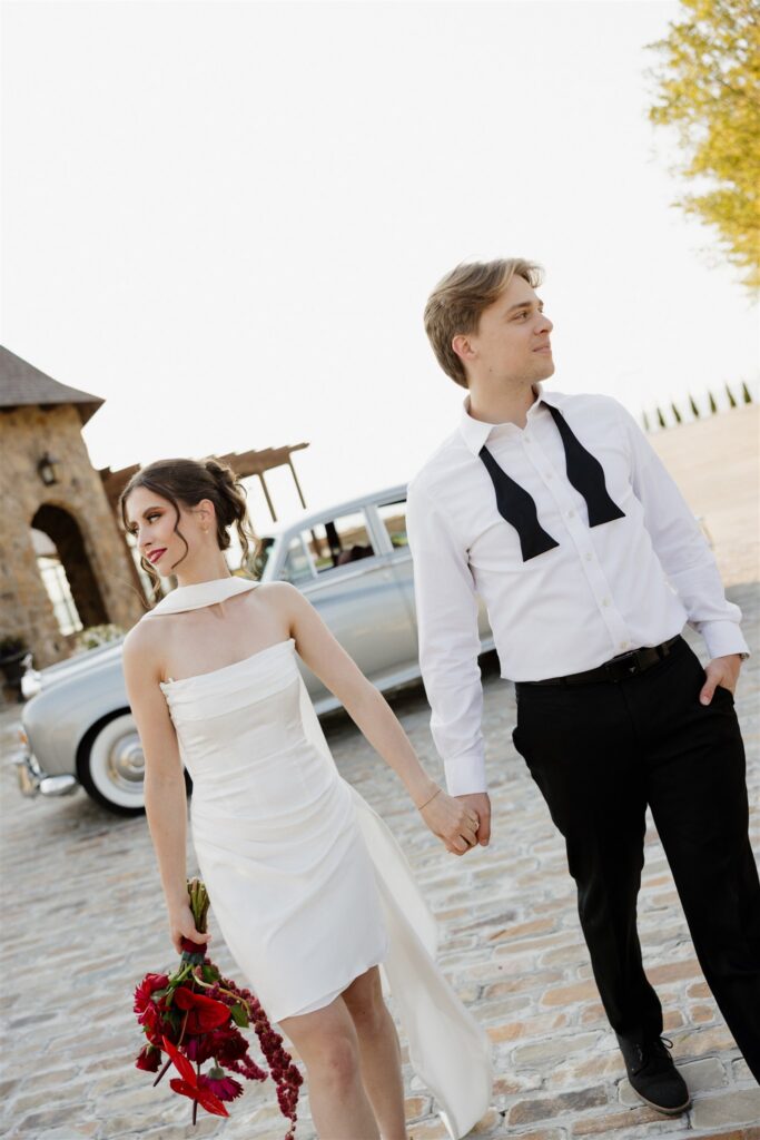 Picture of the bride and groom holding hands
