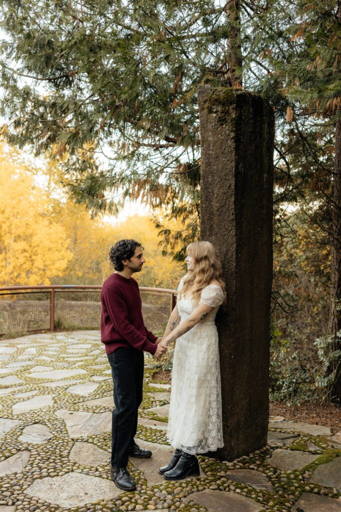 cute picture of the newly engaged couple smiling at each other