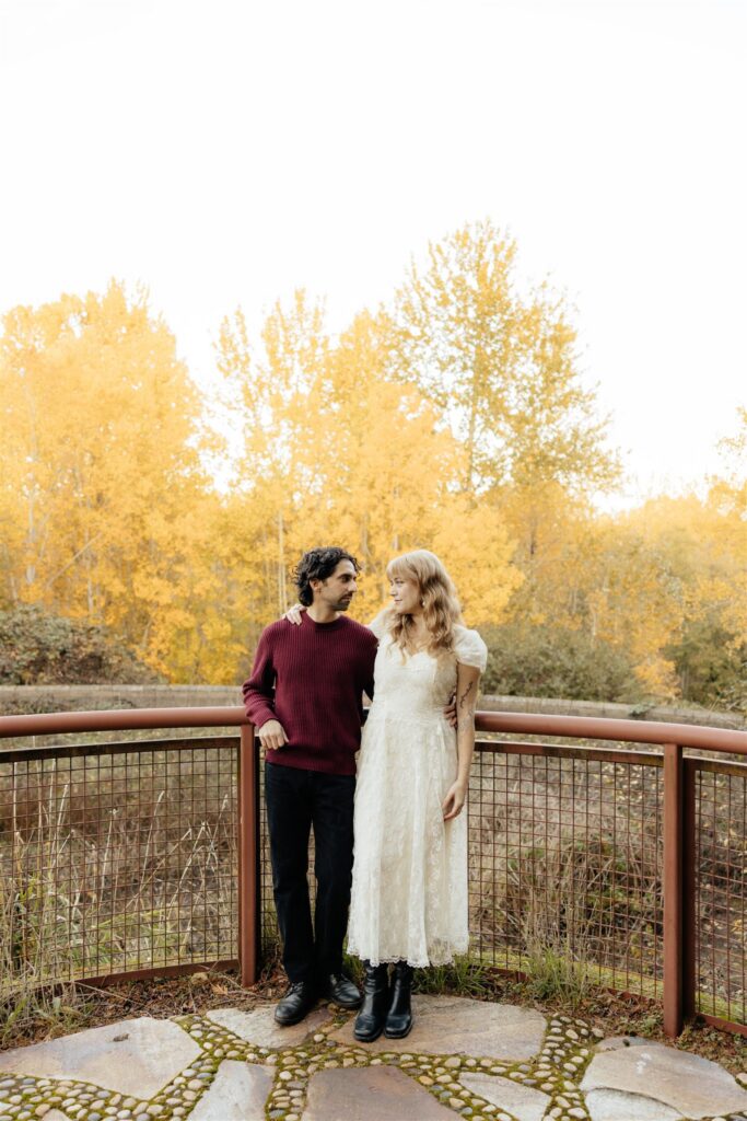 cute picture of the newly engaged couple smiling at each other