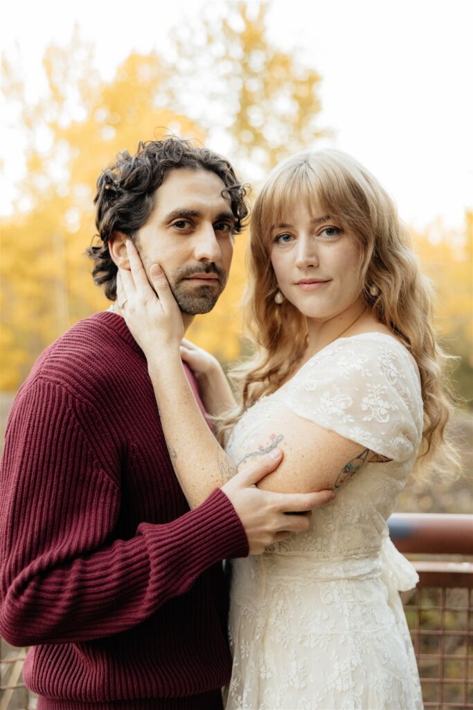 couple smiling at the camera during their photoshoot
