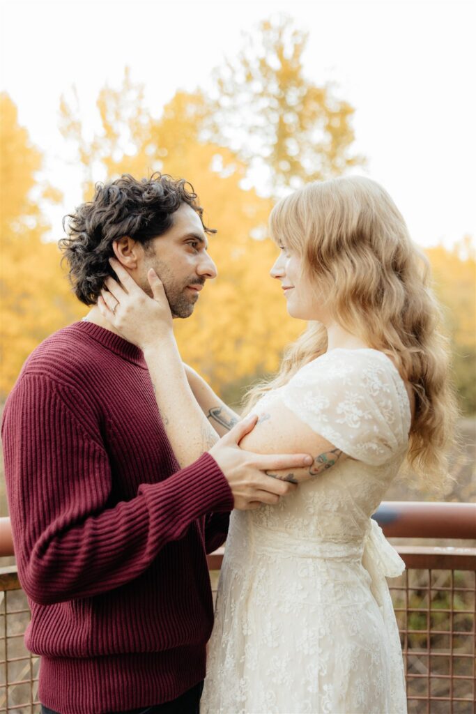 couple smiling at each other during their photoshoot