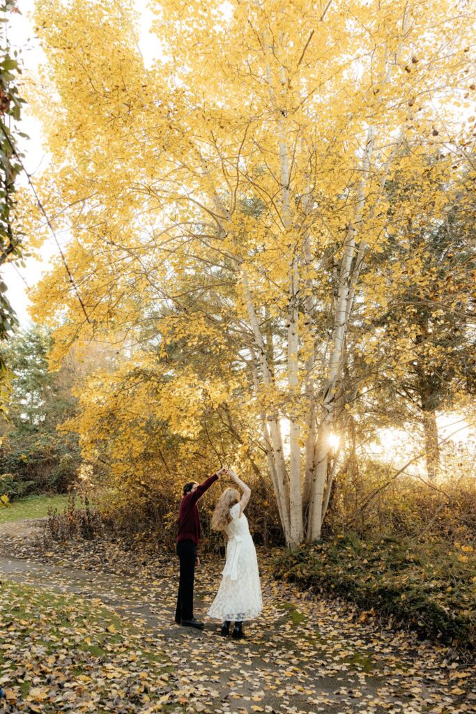 happy couple dancing during their photoshoot