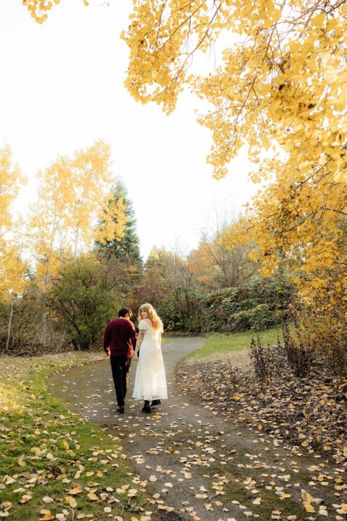 newly engaged couple holding hands during their photoshoot