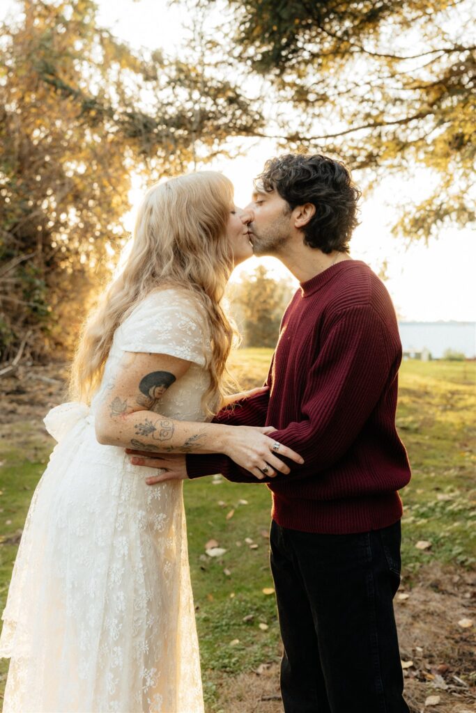 cute picture of the newly engaged couple kissing