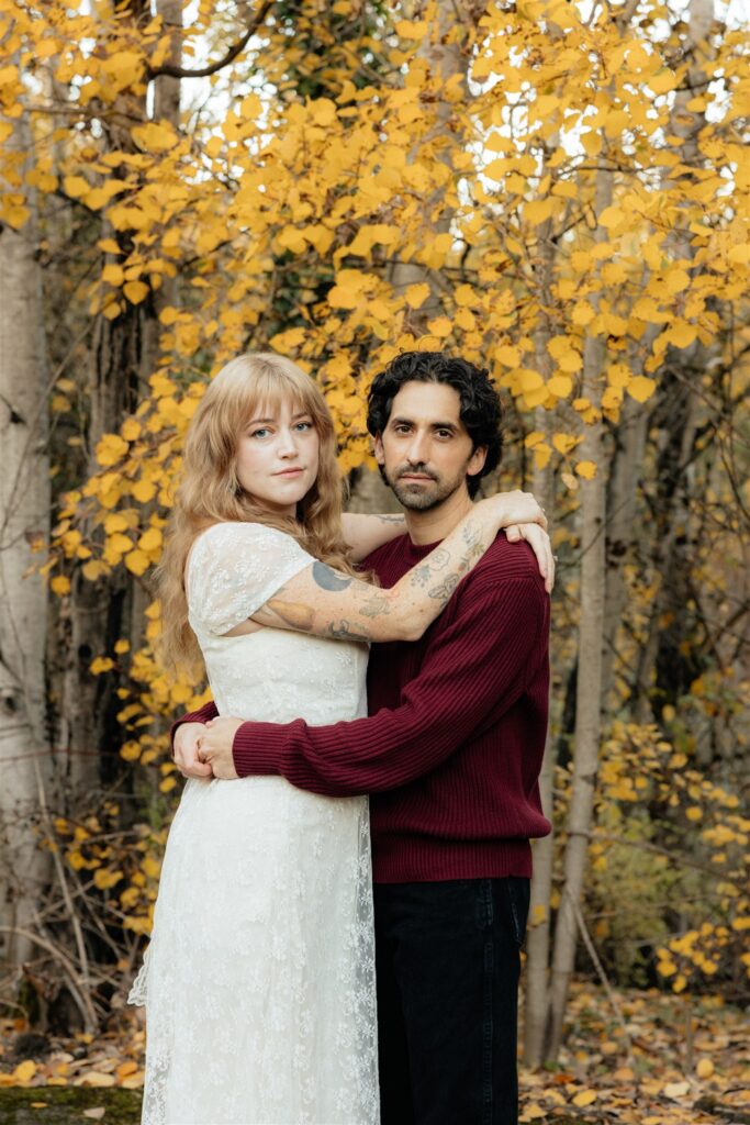 couple smiling at the camera during their photoshoot