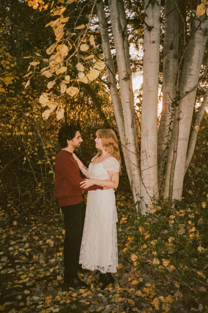 cute picture of the newly engaged couple smiling at each other