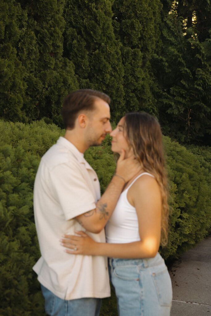 cute picture of the newly engaged couple smiling at each other