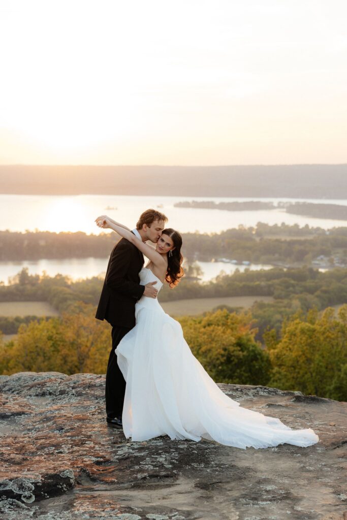 romantic picture of the groom kissing the bride on the cheek