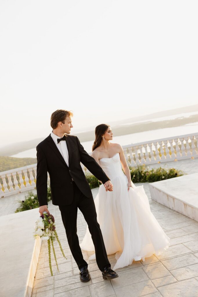 cute picture of the bride and groom holding hands