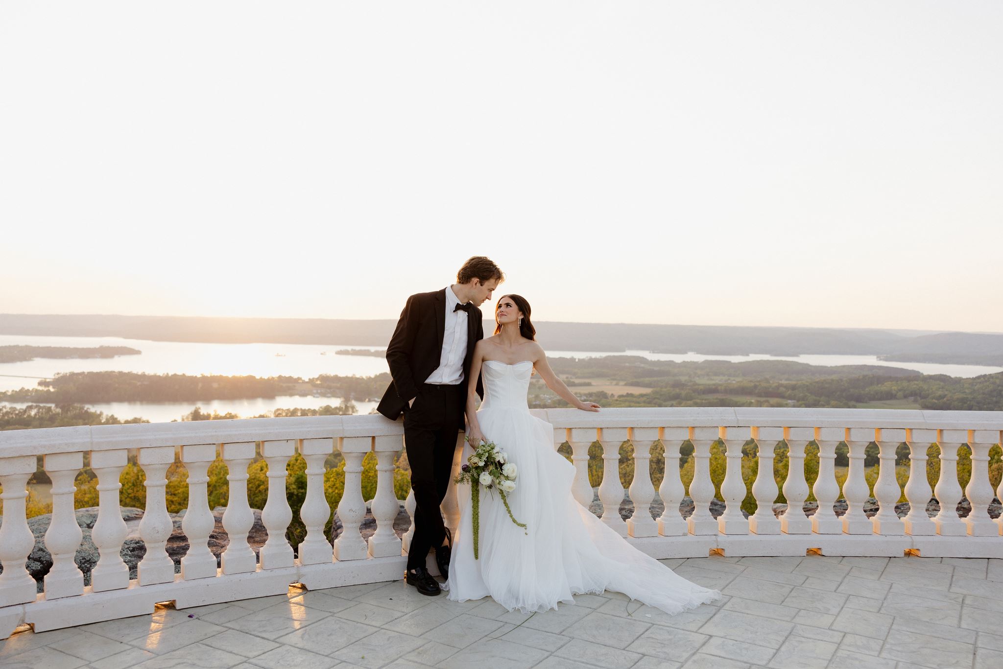 groom kissing the bride on the forehead
