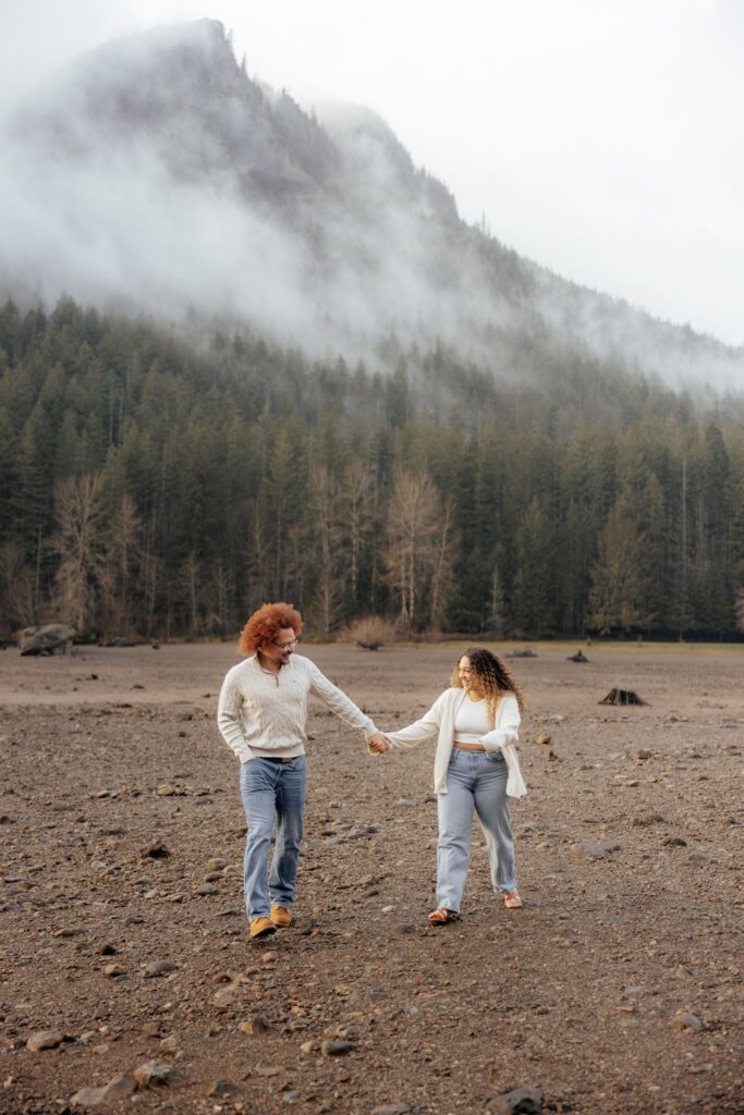 newly engaged couple holding hands during their photoshoot