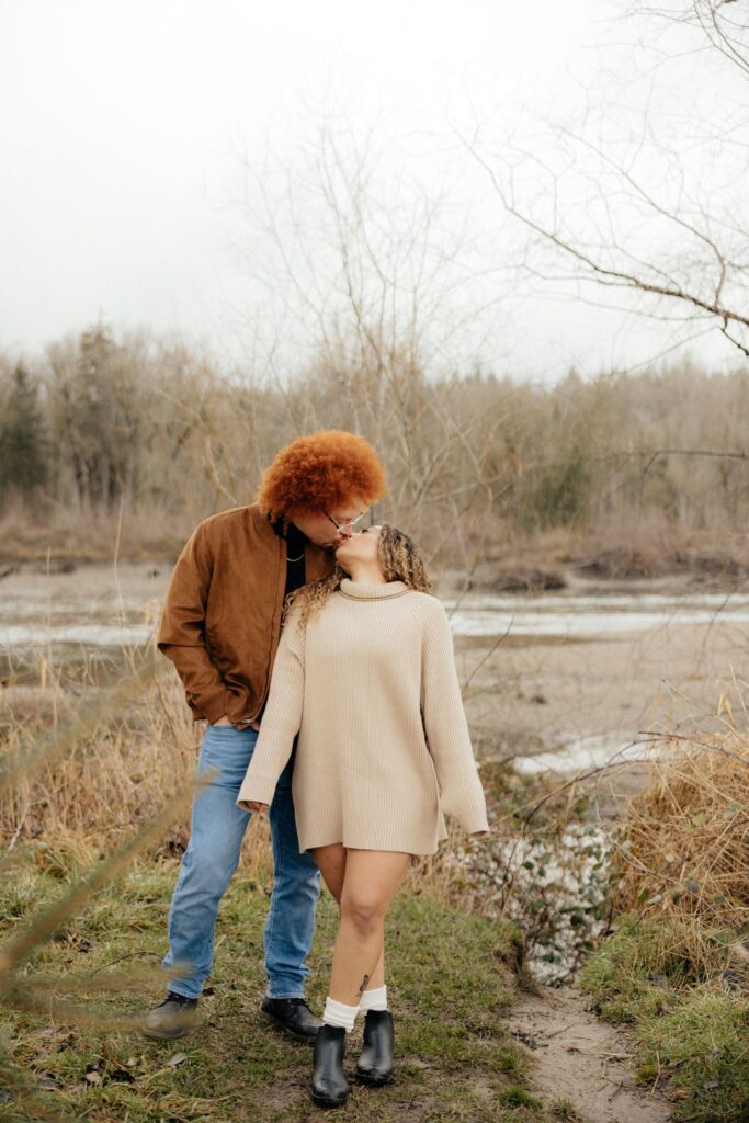 cute picture of the newly engaged couple kissing