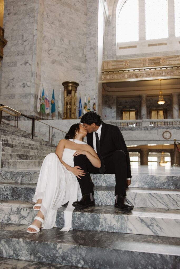 beautiful picture of the newly engaged couple kissing