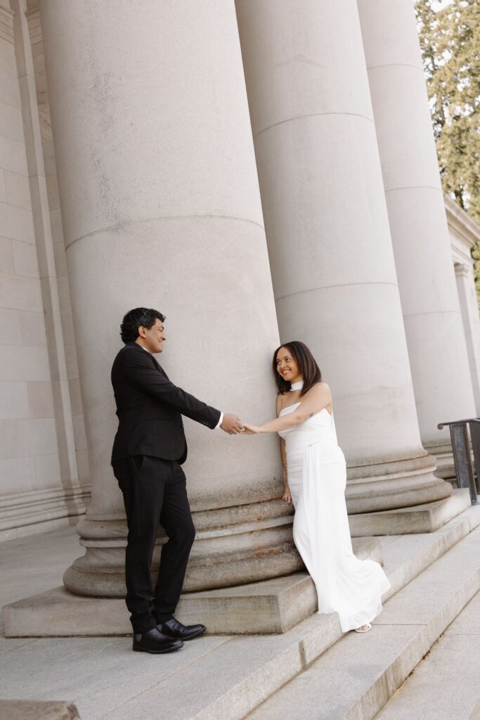 cute picture of the newly engaged couple holding hands