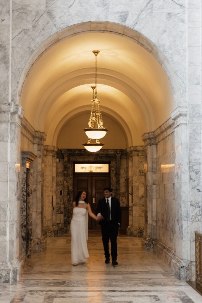 portrait of the newly engaged couple laughing with each other