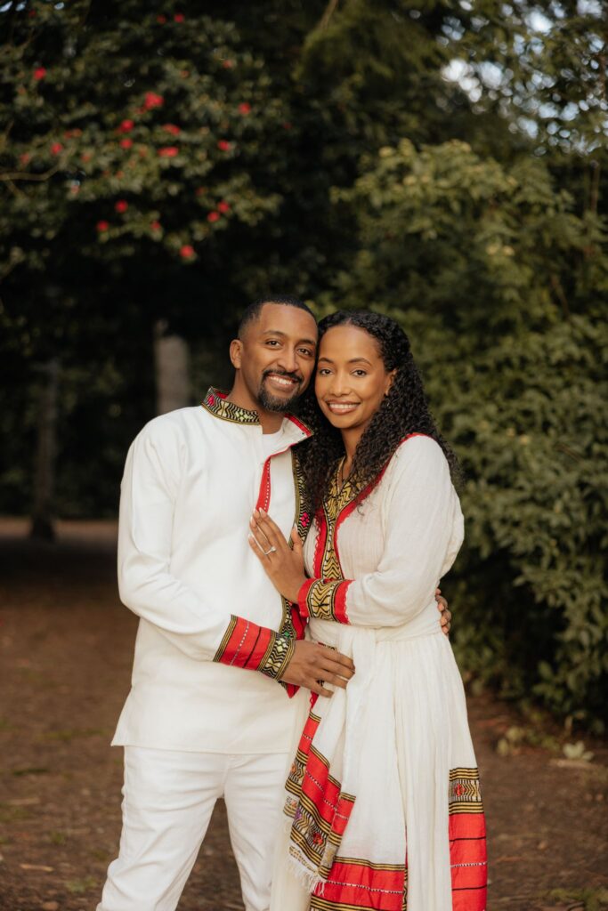 cute picture of the newly engaged couple smiling at the camera during their photoshoot