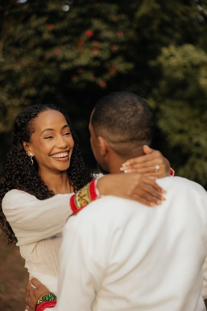 couple laughing at each other during their photoshoot