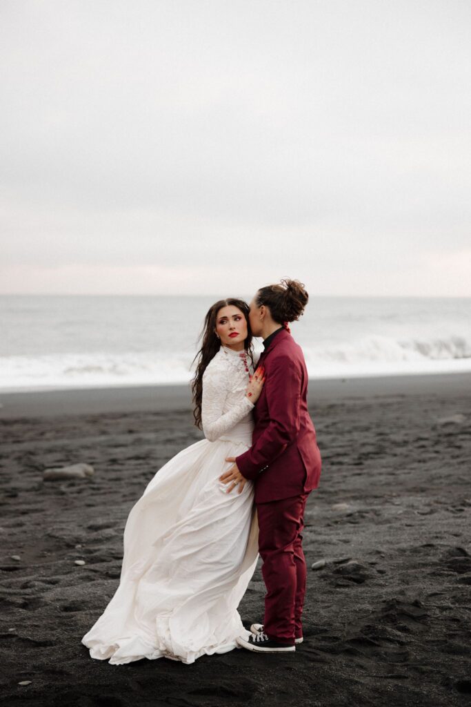 groom kissing the bride on the cheek
