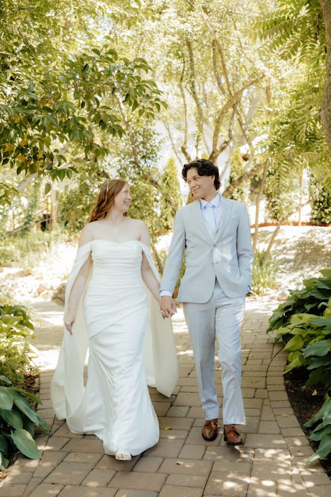 portrait of the newlyweds holding hands