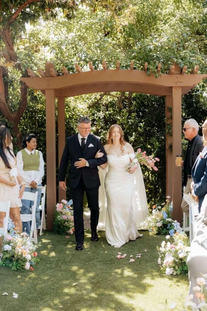 stunning picture of the bride walking down the aisle